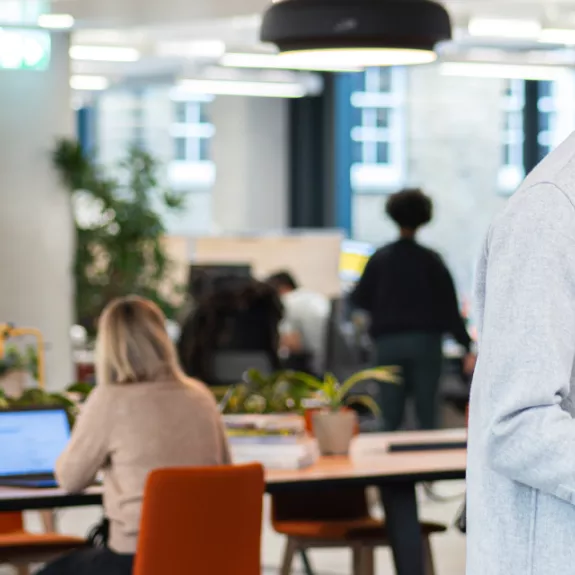 Employee using printer in open office